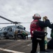 U.S. Sailors Load Radar Equipment Onto An MH-60R Sea Hawk Helicopter