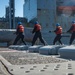 U.S. Sailors Heave The Line During An Underway Replenishment