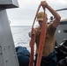 U.S. Sailor Stows Away A Fire Hose