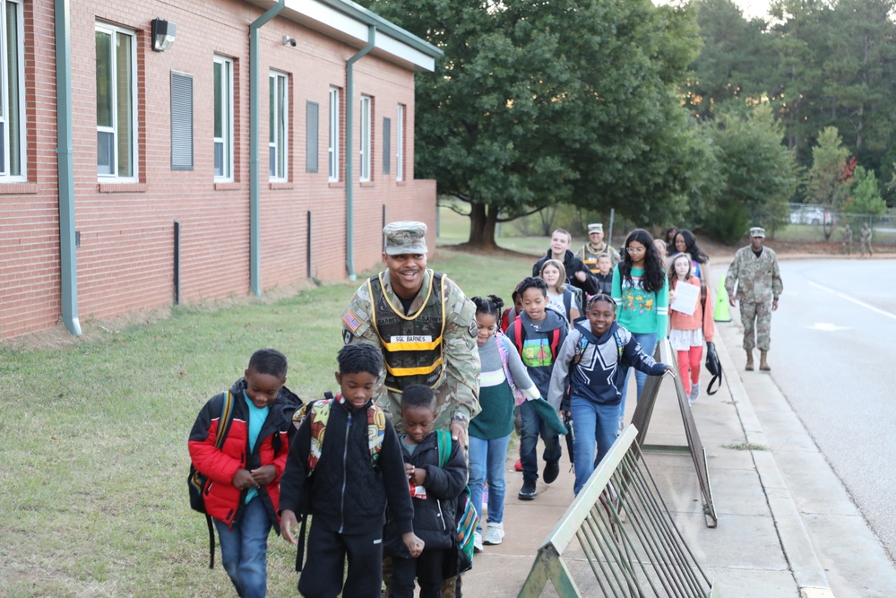 Soldiers Walk Students for the National Walk to School Day at Freedom Park School