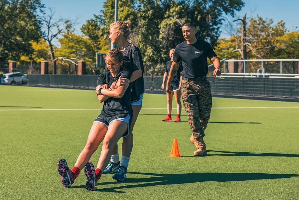 Boston Marines host Harvard field hockey team building