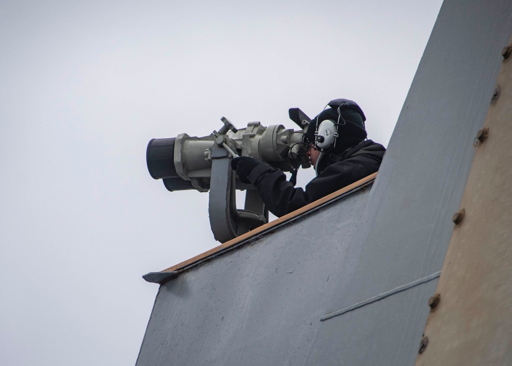 U.S. Sailor Stands A Lookout Watch