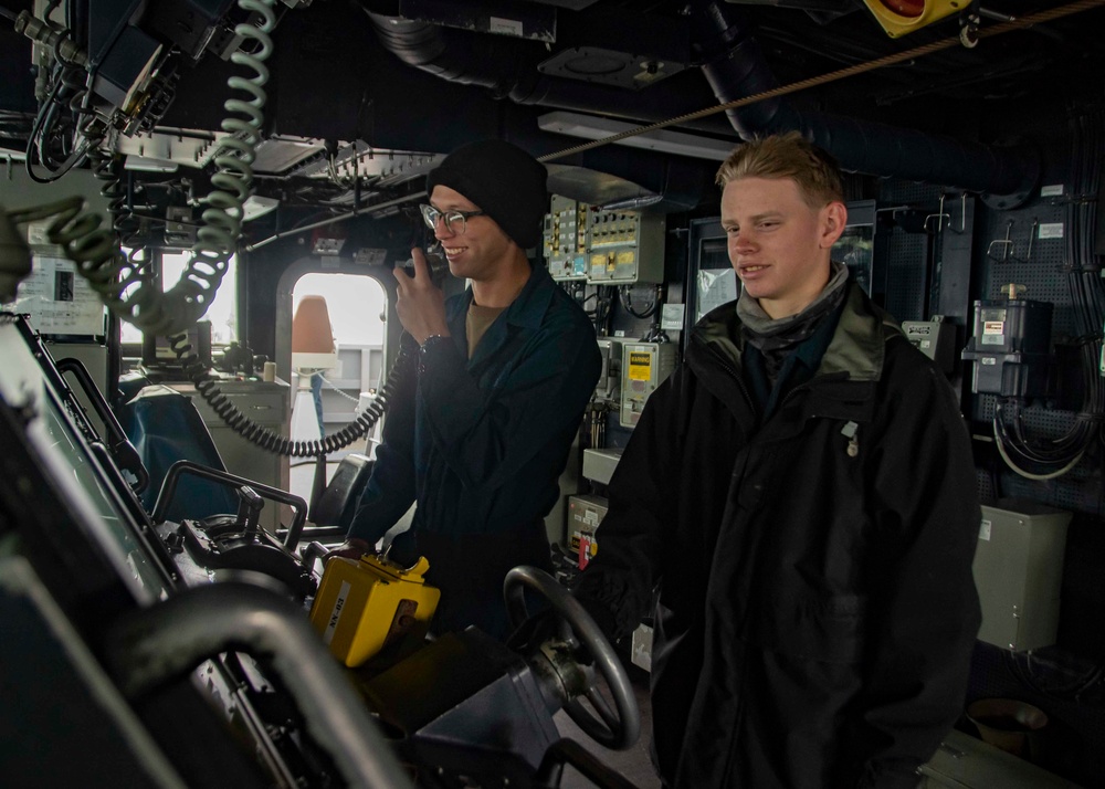 U.S. Sailors Stand A Helmsman Watch