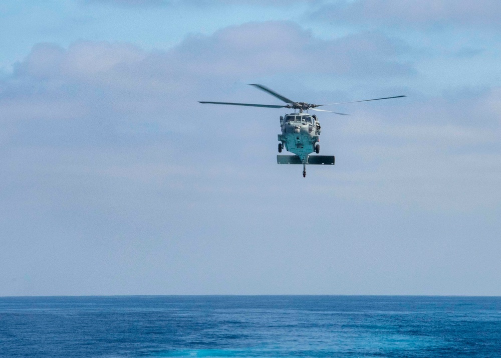 An MH-60S Sea Hawk Helicopter Prepares To Land On The Flight Deck Of USS Wayne E. Meyer