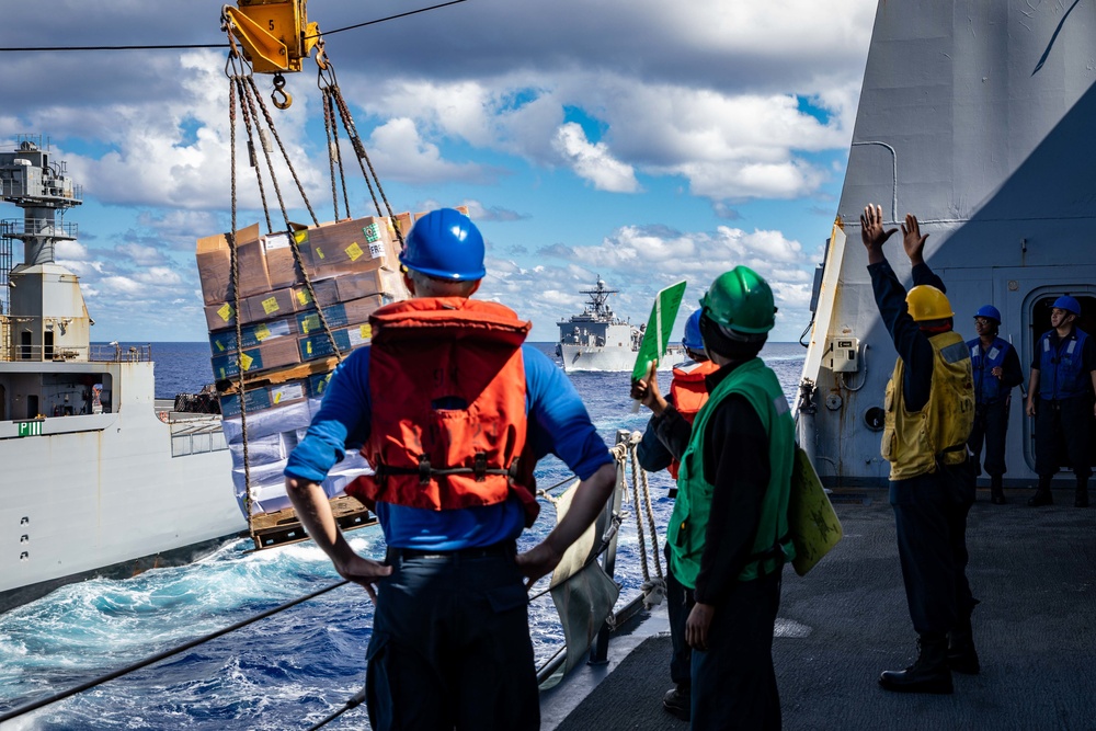 USS Arlington receives supplies from USNS Medgar Evers