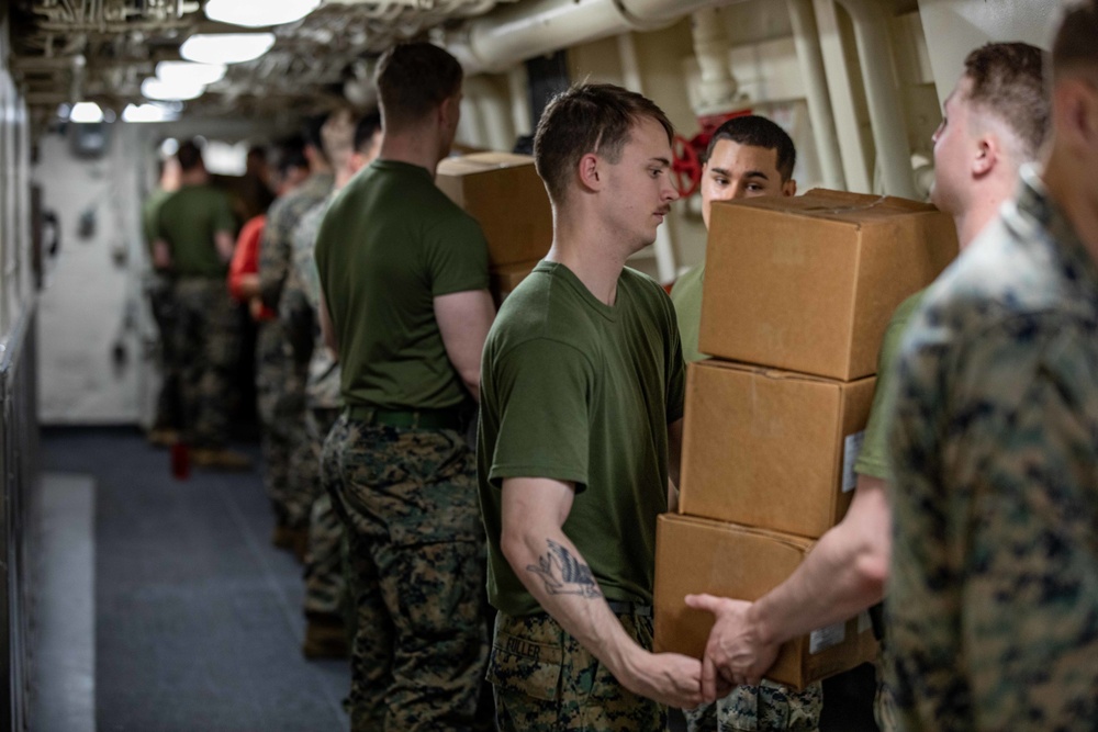 USS Arlington receives supplies from USNS Medgar Evers