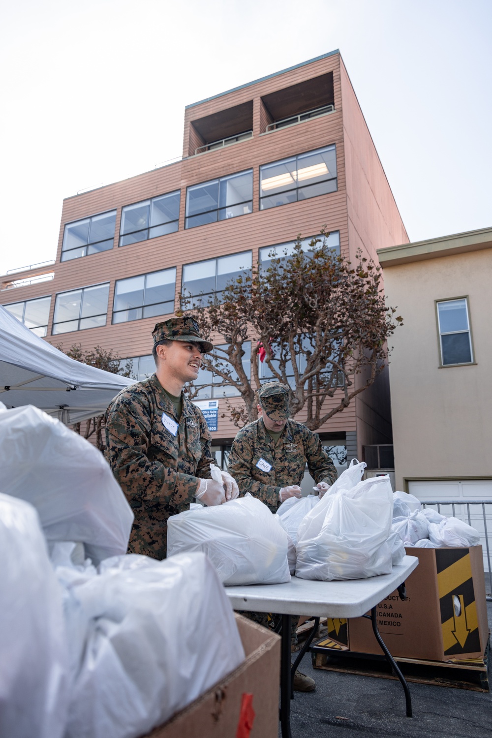 SF Fleet Week: Marines, Sailors prepare bags of food during Food Bank