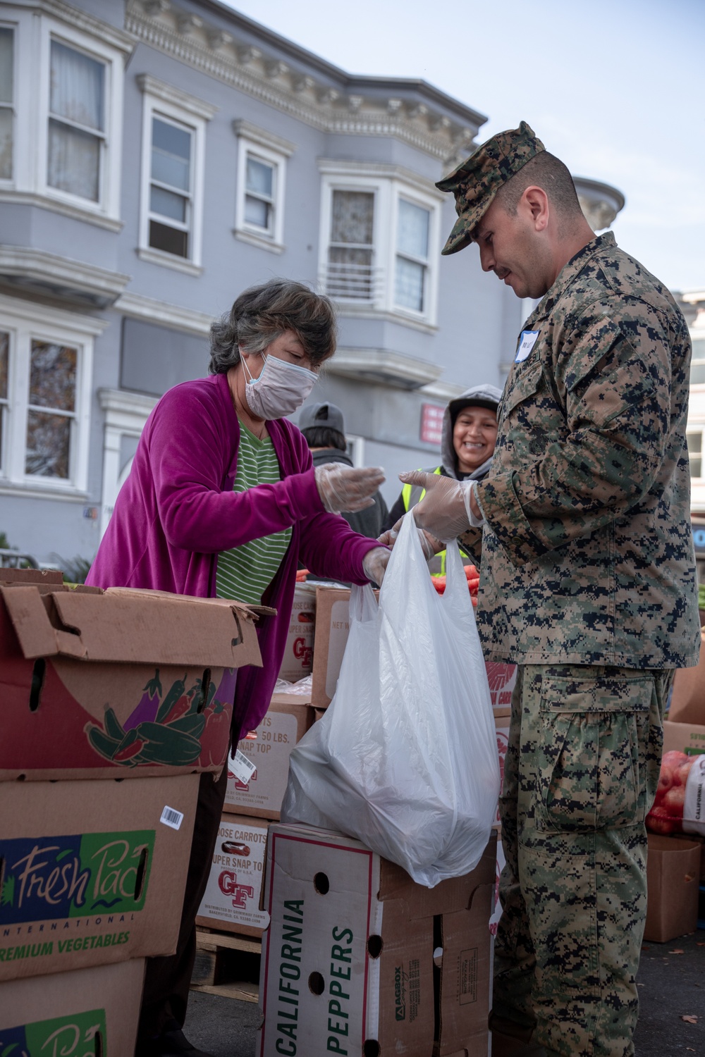 SF Fleet Week: Marines, Sailors prepare bags of food during Food Bank