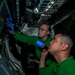 Sailors Perform Cavity Inspection On An Aircraft