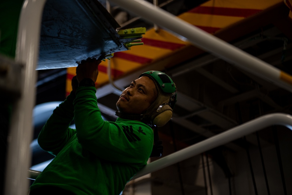 U.S. Navy Sailor perform matainanence