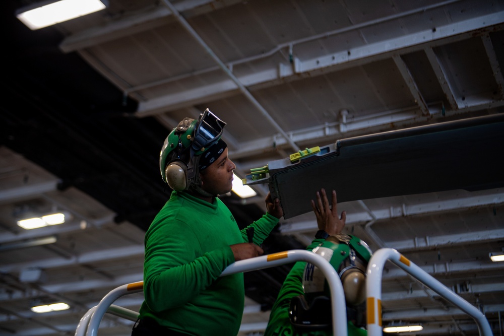 U.S. Navy Sailor perform matainanence