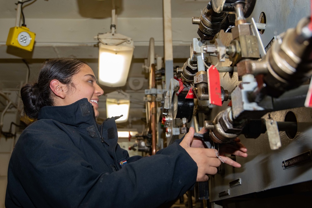 USS Ronald Reagan (CVN 76) Sailors in Primary Flight Control and below decks