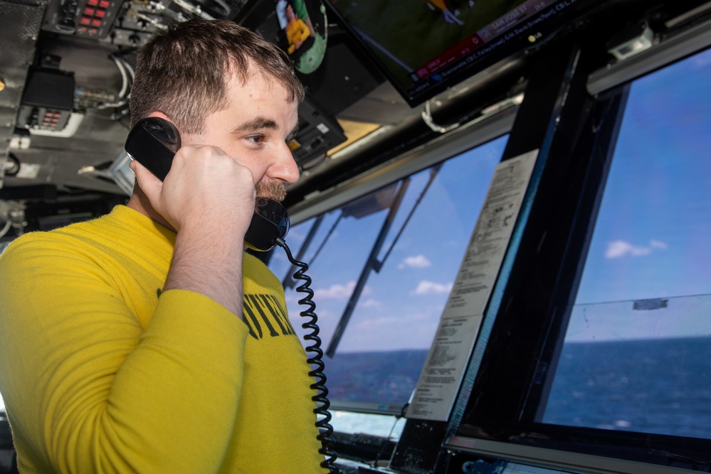 USS Ronald Reagan (CVN 76) Sailors in Primary Flight Control and below decks