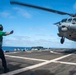 U.S. Sailors Direct An MH-60S Sea Hawk Helicopter