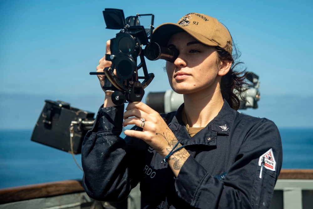 U.S. Navy Quartermaster Utilizes Sextant