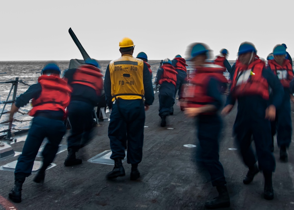 U.S. Sailors Run The Line During An Underway Replenishment