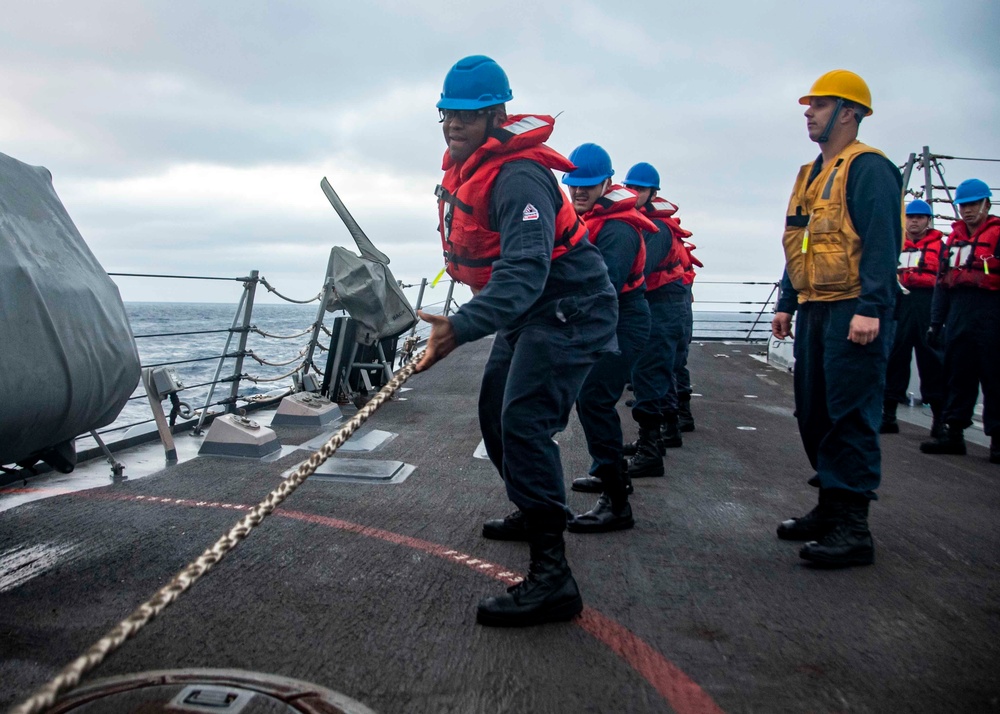 U.S. Sailors Heave The Line During An Underway Replenishment