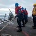 U.S. Sailors Heave The Line During An Underway Replenishment