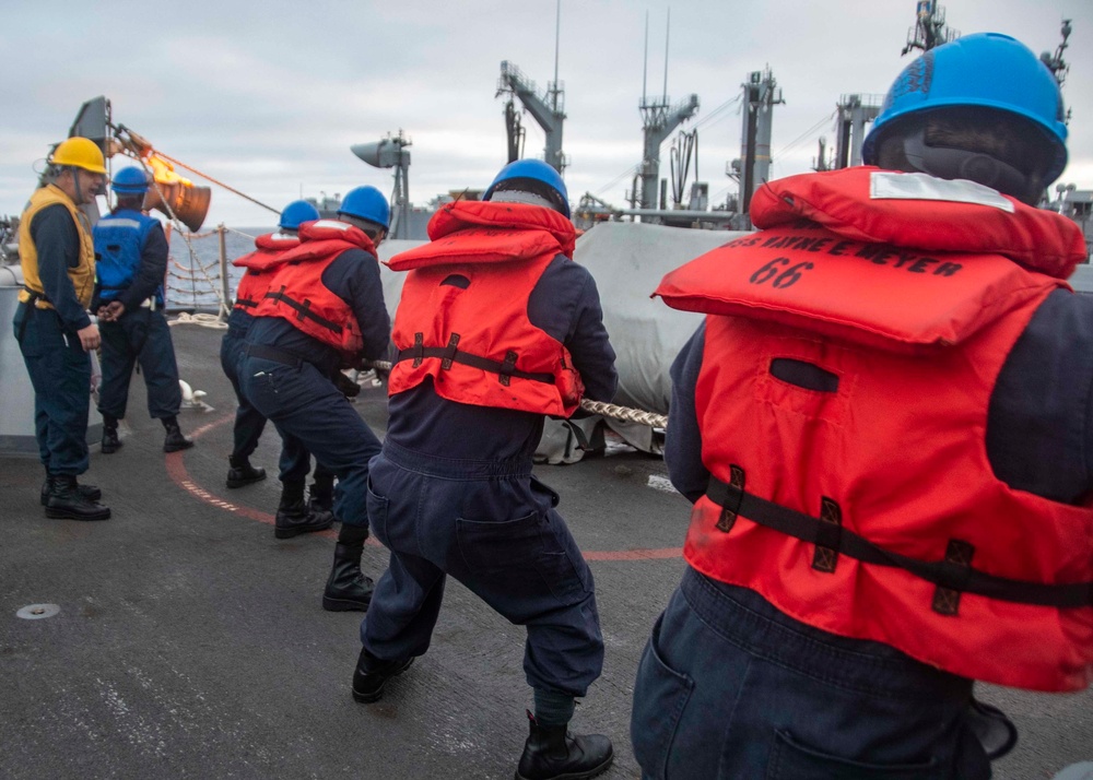 U.S. Sailors Heave The Line During An Underway Replenishment