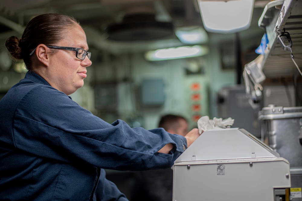 U.S. Navy Sailor Cleans Generator