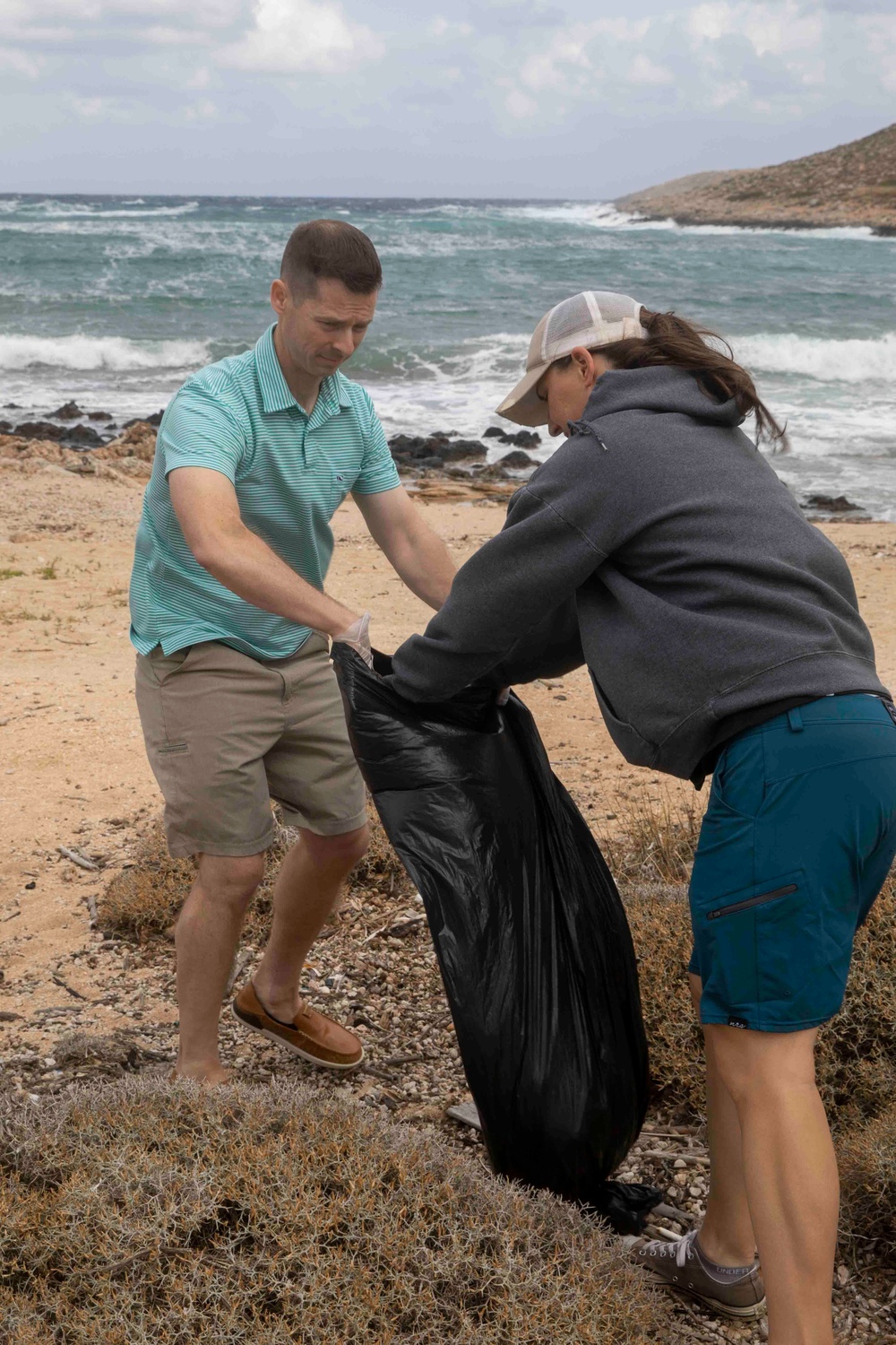 USS George H.W. Bush (CVN 77) Sailors participate in a community relations beach clean up