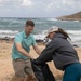 USS George H.W. Bush (CVN 77) Sailors participate in a community relations beach clean up