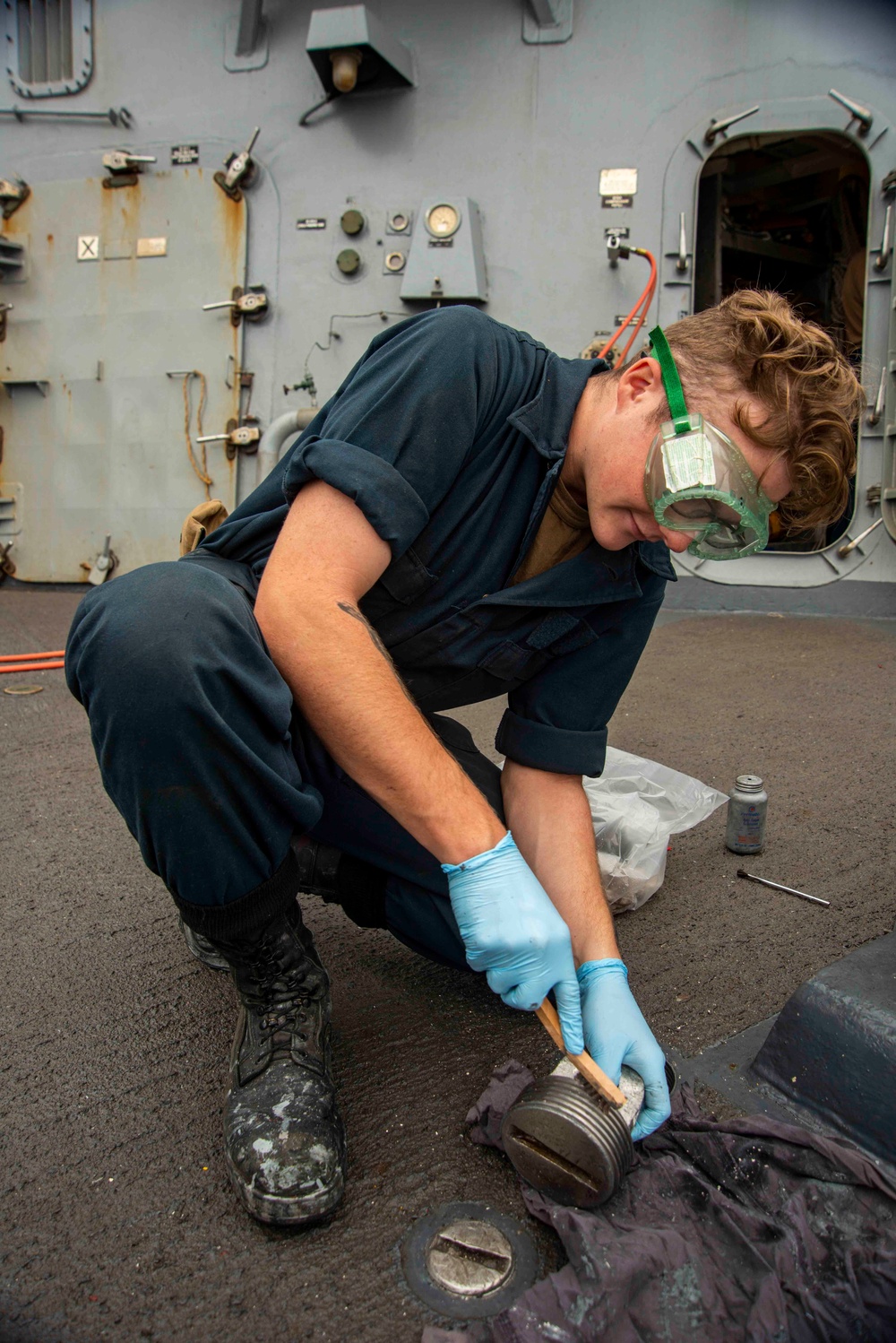 U.S. Navy Seaman Conducts Maintenance