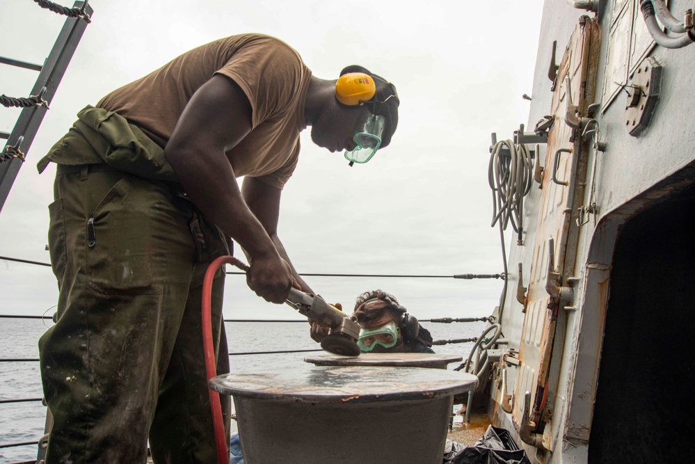 U.S. Navy Seaman Conducts Maintenance