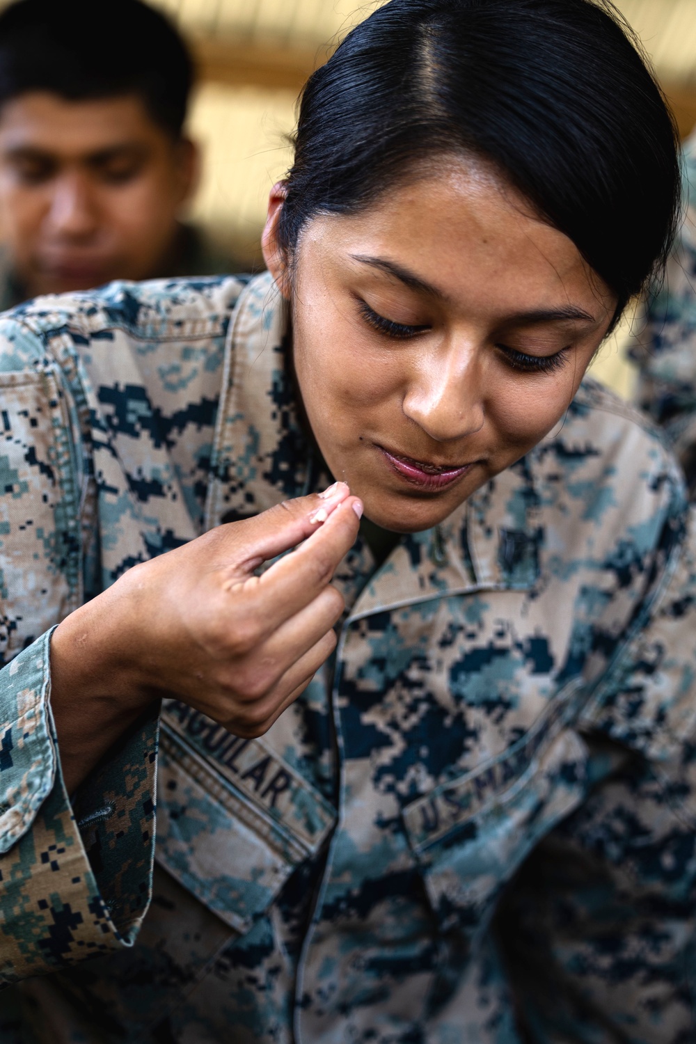 U.S. Marines feast on roasted pork served by Philippine Marines