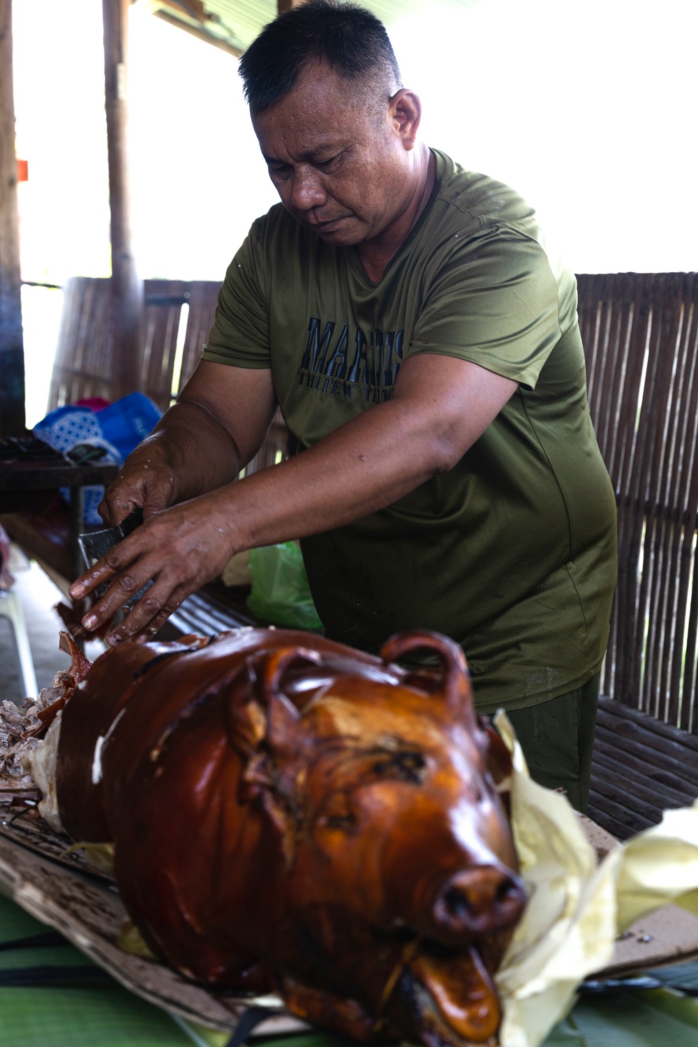 U.S. Marines feast on roasted pork served by Philippine Marines