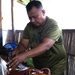 U.S. Marines feast on roasted pork served by Philippine Marines