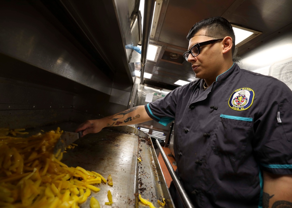 USS Barry (DDG 52) Sailors Prepare Food in the Galley While Operating in the Philippine Sea