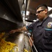 USS Barry (DDG 52) Sailors Prepare Food in the Galley While Operating in the Philippine Sea