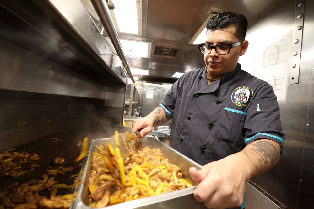 USS Barry (DDG 52) Sailors Prepare Food in the Galley While Operating in the Philippine Sea