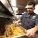 USS Barry (DDG 52) Sailors Prepare Food in the Galley While Operating in the Philippine Sea