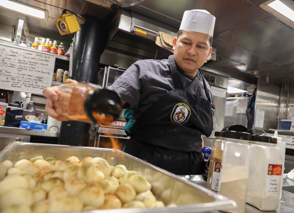 USS Barry (DDG 52) Sailors Prepare Food in the Galley While Operating in the Philippine Sea
