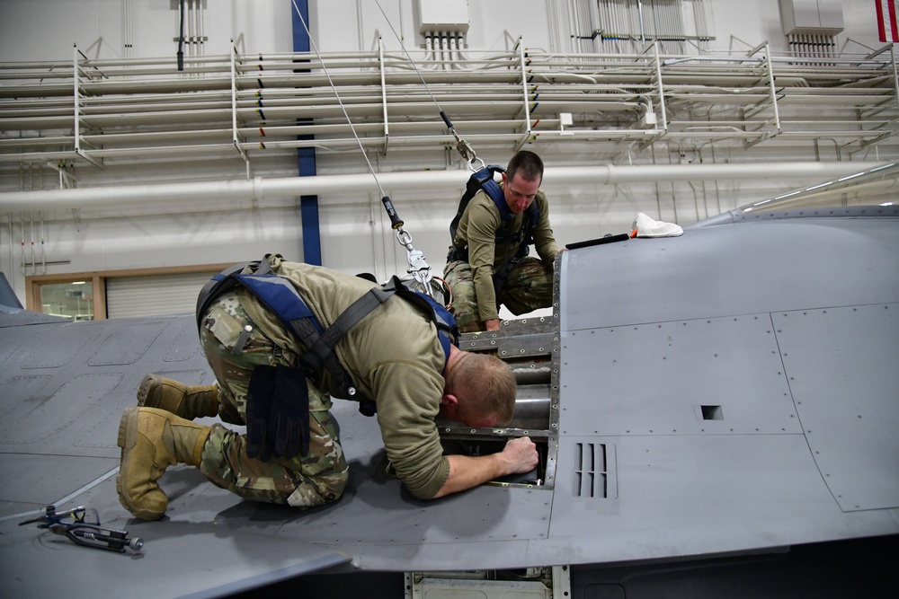 Aircraft Armament Systems specialists remove gun