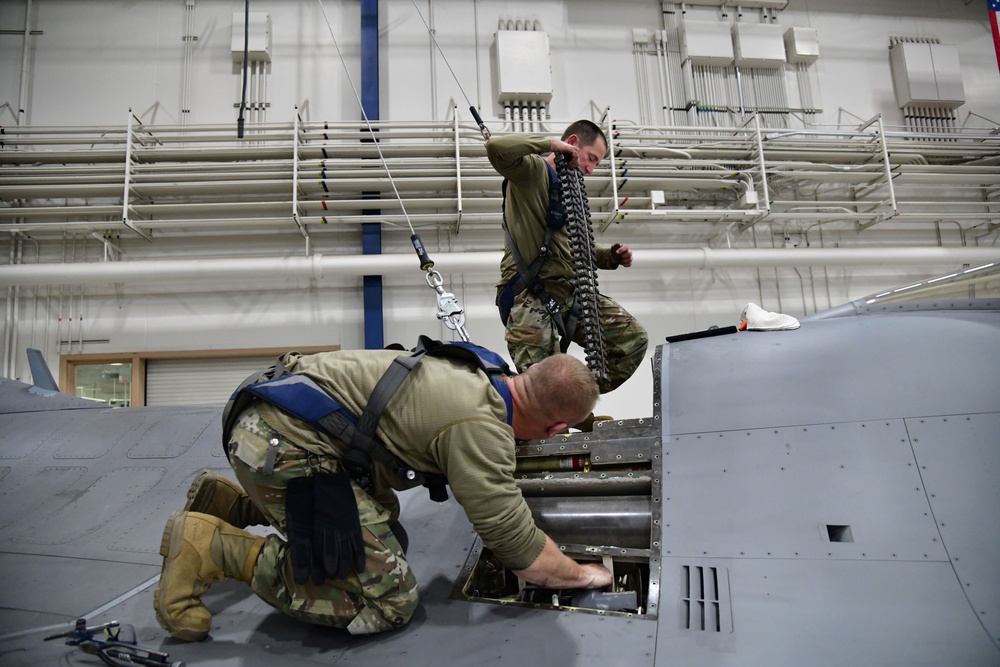 Aircraft Armament Systems specialists remove gun