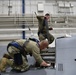 Aircraft Armament Systems specialists remove gun