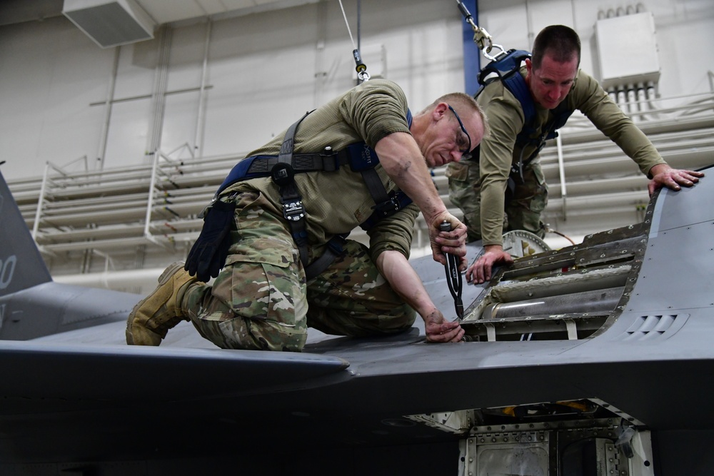 Aircraft Armament Systems specialists remove gun