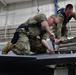 Aircraft Armament Systems specialists remove gun