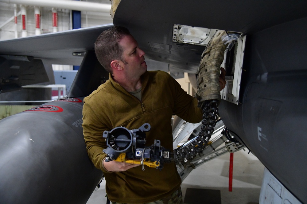 Aircraft Armament Systems specialists remove gun