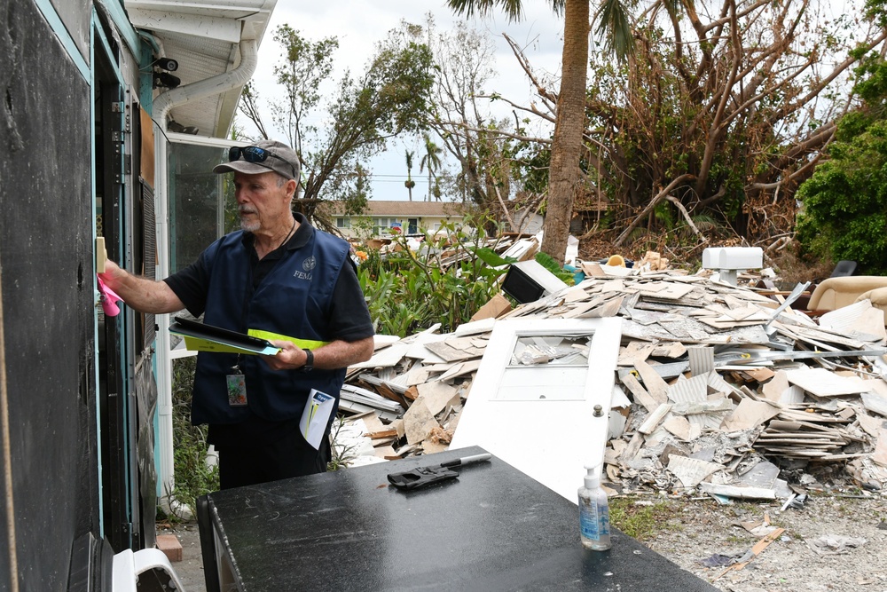 FEMA Disaster Survivor Assistance Team Leaves Flyers in Neighborhood Impacted by Hurricane Ian