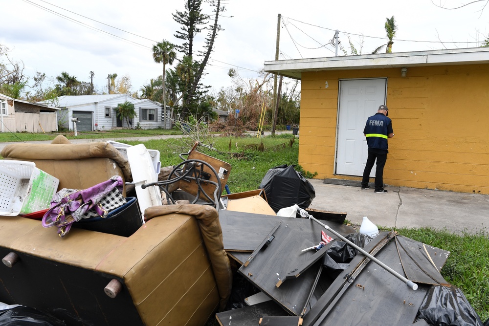 FEMA Disaster Survivor Assistance Team Leaves Flyers in Neighborhood Impacted by Hurricane Ian