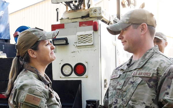 Commander coins Westover Airmen