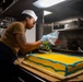 Sailor Decorates The Navy's Birthday Cake