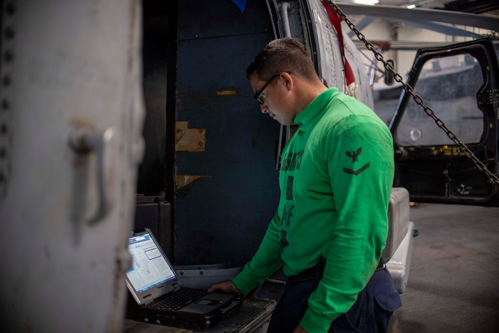 U.S. Navy Sailor Performs Maintenance