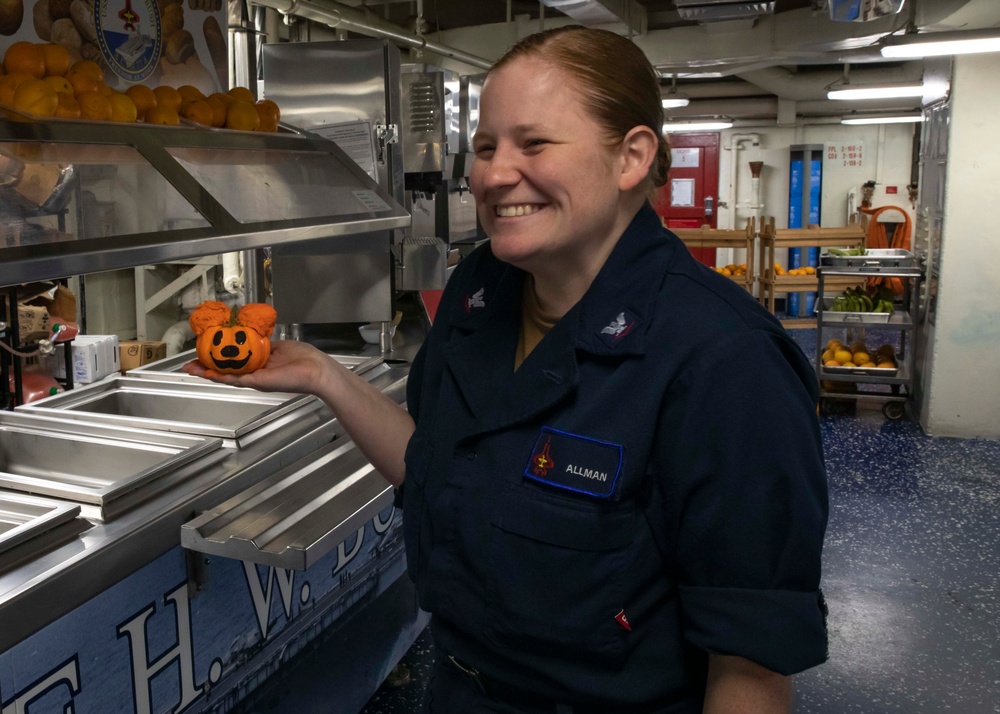 US Navy Sailors Decorate Miniature Pumpkins Aboard USS George H.W. Bush