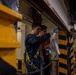 U.S. Navy Sailors Lubricate Weapons Elevator