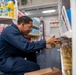 U.S. Navy Sailor Restocks Groceries